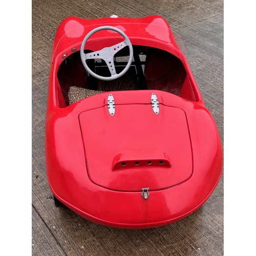 229 - Automobilia, racing car, toy car,  pedal car, a Jaguar XKSS ride in petrol engined Cheetah Cub from ... 