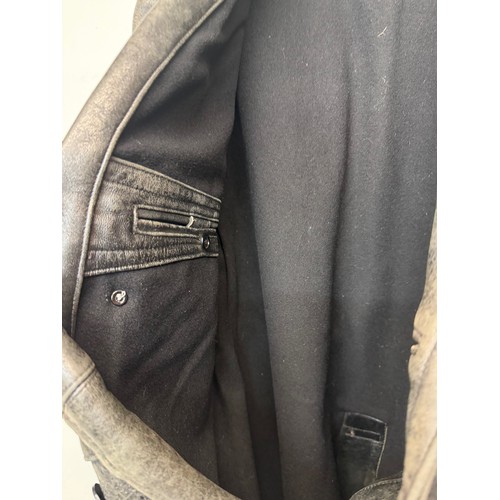 181 - Automobilia, Vintage clothing, a leather Police Motorcyclists coat.

This lot is available for in-ho... 