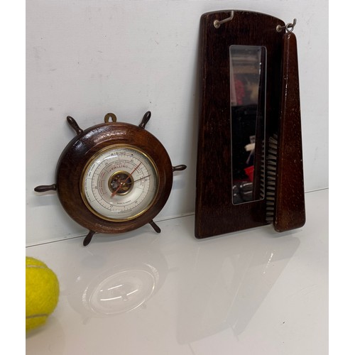 467 - A ships wheel mounted with a barometer and a hall mirror with a clothes brush attached.

This lot is... 