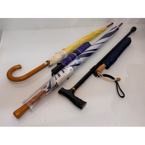 468 - A collection of umbrellas and a collapable walking stick.

This lot is available for in-house shippi... 