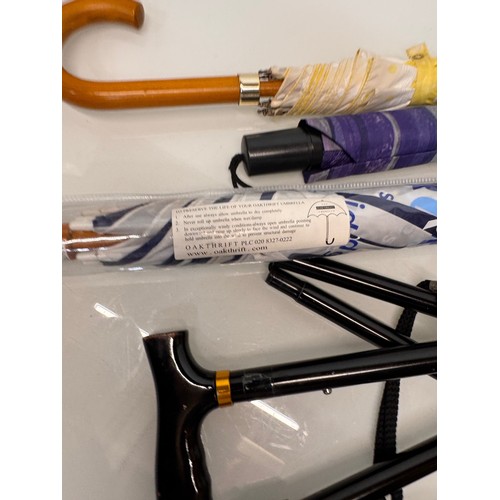 468 - A collection of umbrellas and a collapable walking stick.

This lot is available for in-house shippi... 