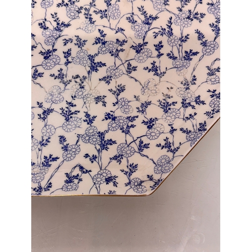 488 - English C20th century ceramics, a large meat platter with a delicate floral design and gilded rim. 4... 