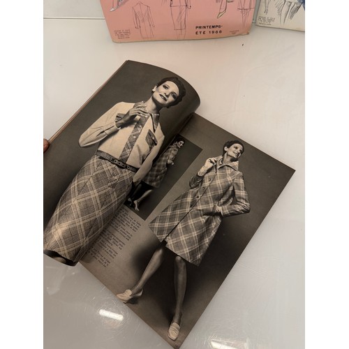 203 - Vintage Fashions, a manufactuers posters on board for 1960 ladies clothing, with a 1973 brochure.

T... 