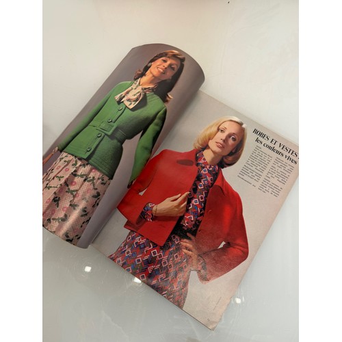 203 - Vintage Fashions, a manufactuers posters on board for 1960 ladies clothing, with a 1973 brochure.

T... 