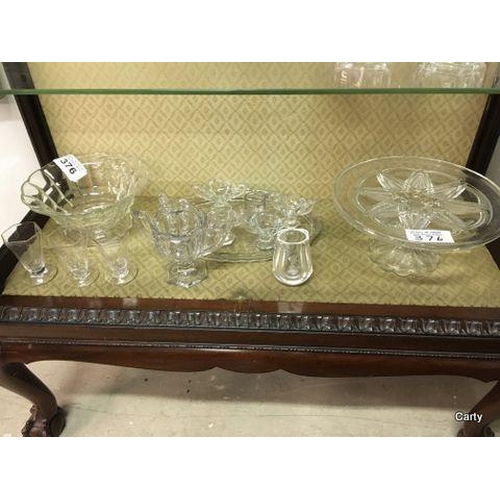 376 - Misc items on Bottom Shelf of Cabinet