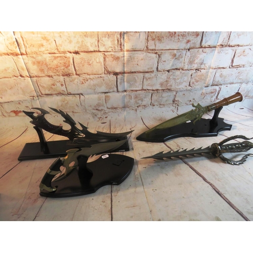 11 - FOUR FANTASY STYLE KNIVES - FOR DISPLAY PURPOSES ONLY