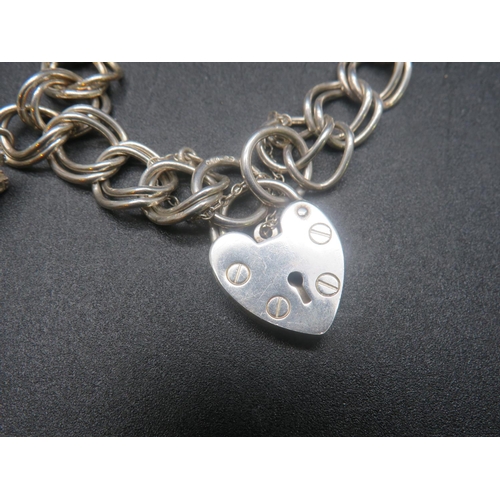 380 - STERLING SILVER BRACELET AND CHARMS