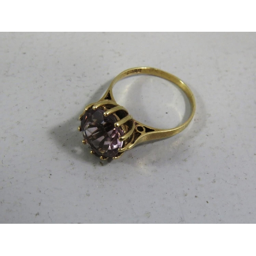 390 - 9CT GOLD RING WITH LARGE PINK STONE