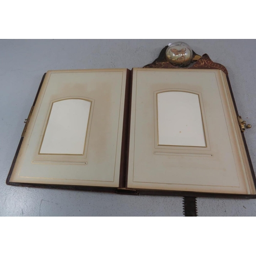 303 - A LEATHER BOUND PHOTOGRAPH ALBUM