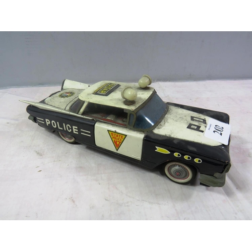 202 - VINTAGE TIN PLATE POLICE CAR ICHIKO