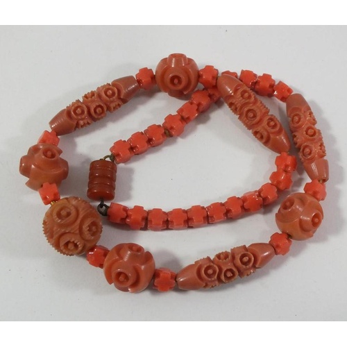 161 - VINTAGE ART DECO CARVED CORAL AND CELLULOID NECKLACE IN LOVELY CONDITION