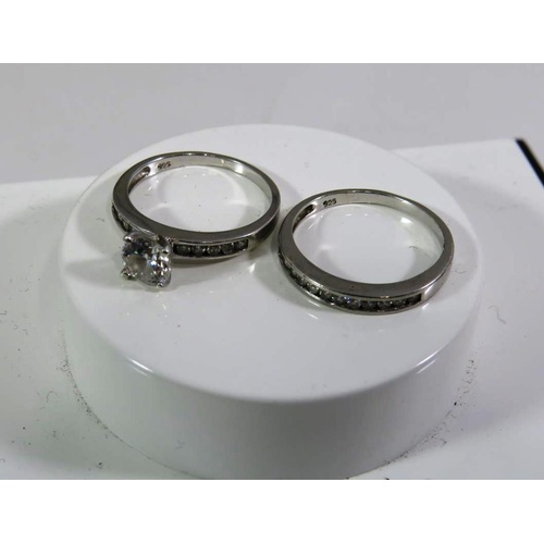 180 - TWO SILVER AND WHITE TONE RINGS