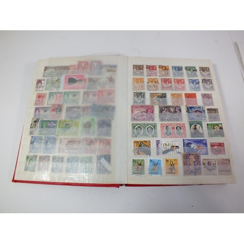 424 - RED STOCK BOOK WITH ESTIMATED 1500 STAMPS BRITISH/COMMONWEALTH