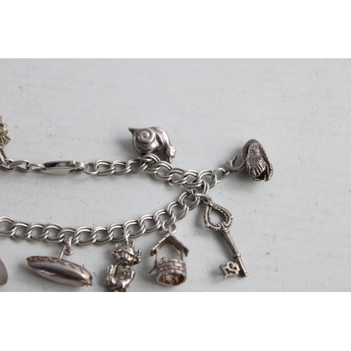 193 - Vintage Stamped .925 STERLING SILVER Charm Bracelet w/ Various Charms (30g)