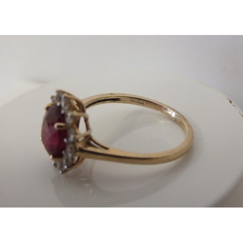 223 - 9ct GOLD RUBY AND DIAMOND CLUSTER RING 2.7g, SIZE Q