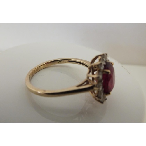 223 - 9ct GOLD RUBY AND DIAMOND CLUSTER RING 2.7g, SIZE Q