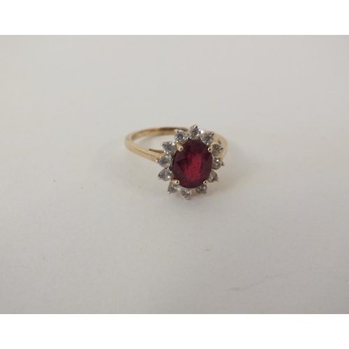 223 - 9ct GOLD RUBY AND DIAMOND CLUSTER RING 2.7g, SIZE Q