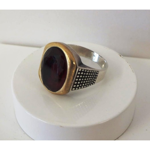 227 - STERLING SILVER RING WITH MOUNTED RED STONE, SIZE Y