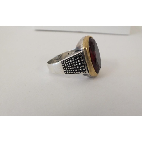 227 - STERLING SILVER RING WITH MOUNTED RED STONE, SIZE Y