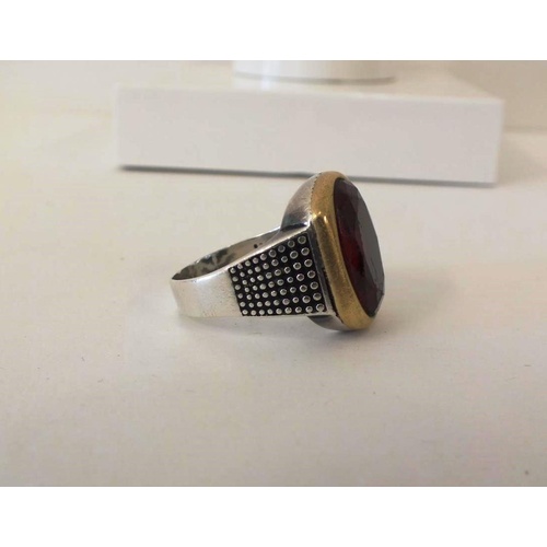 227 - STERLING SILVER RING WITH MOUNTED RED STONE, SIZE Y