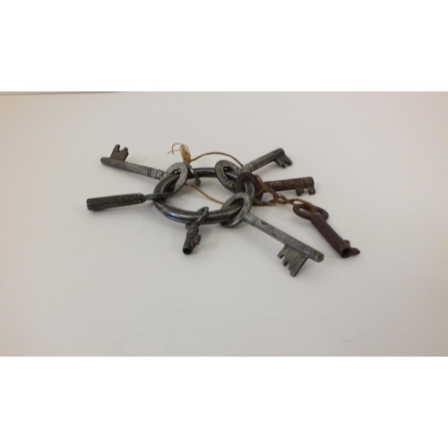 232 - SIX SMALL ANTIQUE KEYS ON ORIGINAL KEY RING INCLUDES A HOBBS & Co LEVER SAFE KEY