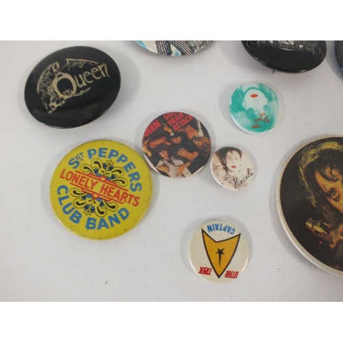 298 - ELEVEN BADGES INCLUDES BEATLES,QUEEN,ALICE COOPER ETC