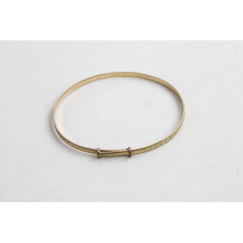 43 - Four Sterling Silver Expandable Bangles