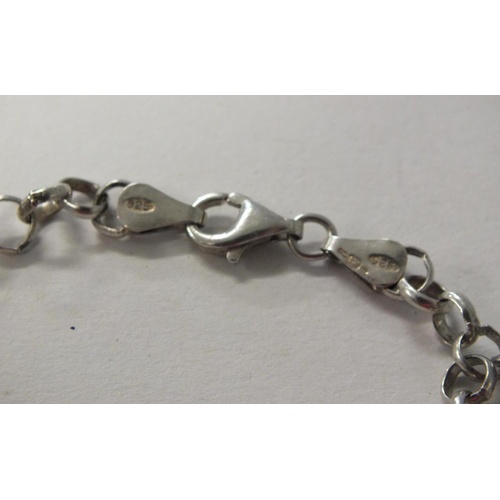 235 - STERLING SILVER CURB LINK BRACELET WITH TWO SILVER HEART CHARMS