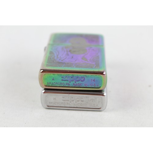 31 - 2 x Assorted ZIPPO CIGARETTE  Inc Iridescent, Buddha, Pipe Design Etc