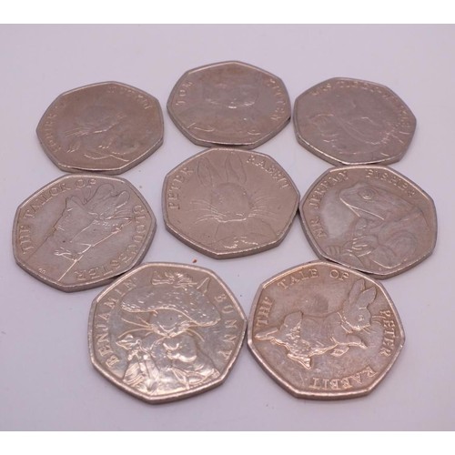 326 - EIGHT COLLECTABLE PETER RABBIT FIFTY PENCE COINS