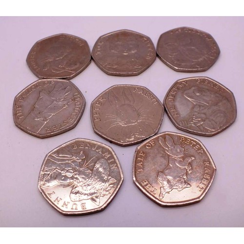 326 - EIGHT COLLECTABLE PETER RABBIT FIFTY PENCE COINS