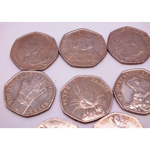 326 - EIGHT COLLECTABLE PETER RABBIT FIFTY PENCE COINS