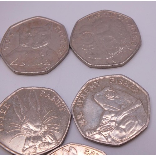 326 - EIGHT COLLECTABLE PETER RABBIT FIFTY PENCE COINS