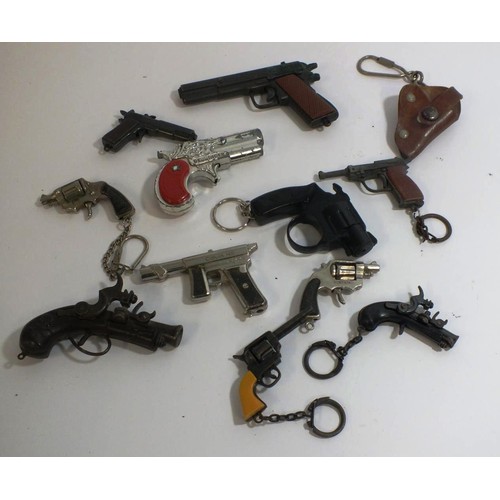 352 - ELEVEN VINTAGE MINIATURE CAP GUNS AND KEYRINGS