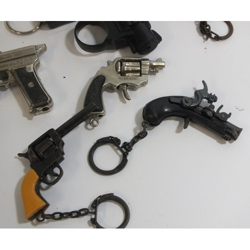 352 - ELEVEN VINTAGE MINIATURE CAP GUNS AND KEYRINGS