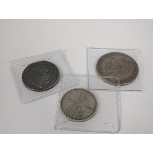 391 - THREE FOREIGN SILVER COINS