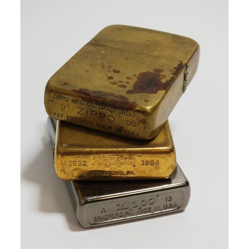 394 - THREE VINTAGE ZIPPO LIGHTERS