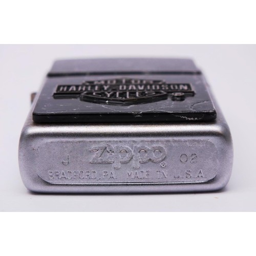 66 - THREE ZIPPOS;
IRRIDESCENT CHROME HARLEY DAVIDSON- L02
HARLEY DAVIDSON FLAME BLACK MATTE- A04
HARLEY ... 