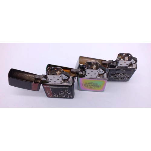 66 - THREE ZIPPOS;
IRRIDESCENT CHROME HARLEY DAVIDSON- L02
HARLEY DAVIDSON FLAME BLACK MATTE- A04
HARLEY ... 
