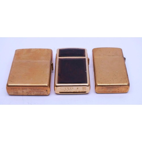 112 - THREE ZIPPOS;
SLIM LINE SOLID BRASS- J03
SLIM LINE RARE GOLD PLATED TORTOISE SHELL- 2000 F XVI
GOLD ... 