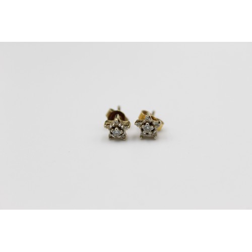 54 - 2 x 9ct floral cluster stud earrings includes diamond set pair (2.2g)