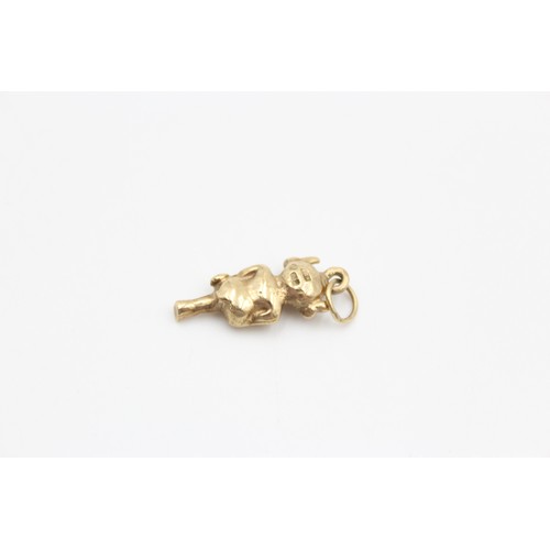 61 - 9ct cross legged imp charm (2.8g)