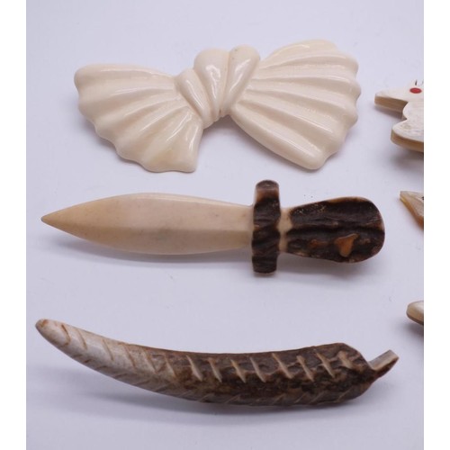 381 - COLLECTION OF VINTAGE CARVED BONE AND CELLULOID BROOCHES