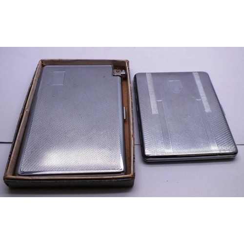 388 - TWO CHROME CIGARETTE CASES AND ASSORTMENT OF LIGHTERS