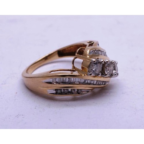 422 - 14K GOLD DIAMOND RING WITH 3 MAIN DIAMONDS & 32 BAGUETTE CUT DIAMONDS 4.2g SIZE N