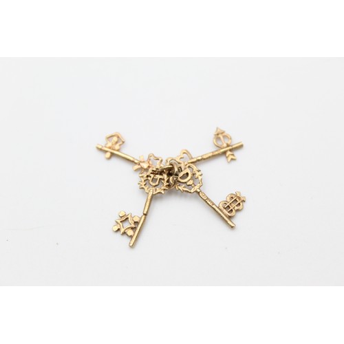 57 - 9ct four keys charm (1.5g)