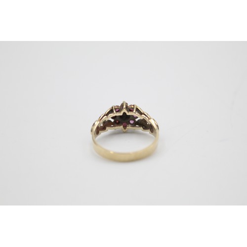 209 - 9ct gold 1970s texture diamond & ruby halo ring (2.8g)