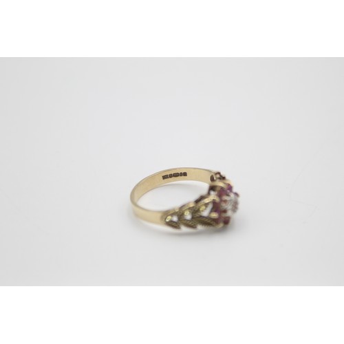 209 - 9ct gold 1970s texture diamond & ruby halo ring (2.8g)