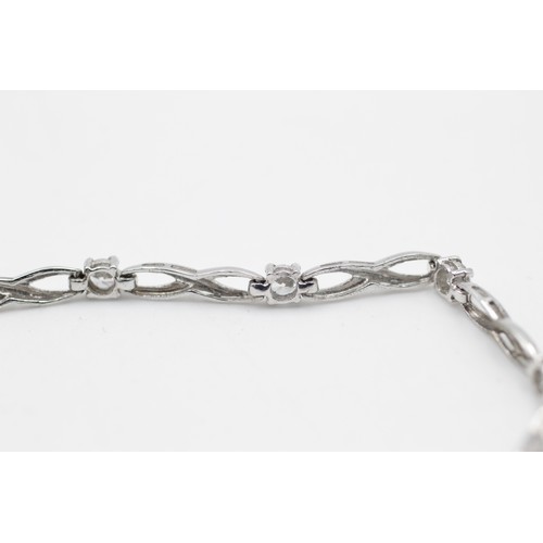 93 - 9ct white gold infinity link gemstone bracelet (4.4g)