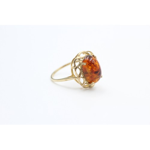 237 - 9ct gold vintage amber celtic braid setting dress ring (2.3g)  SIZE P